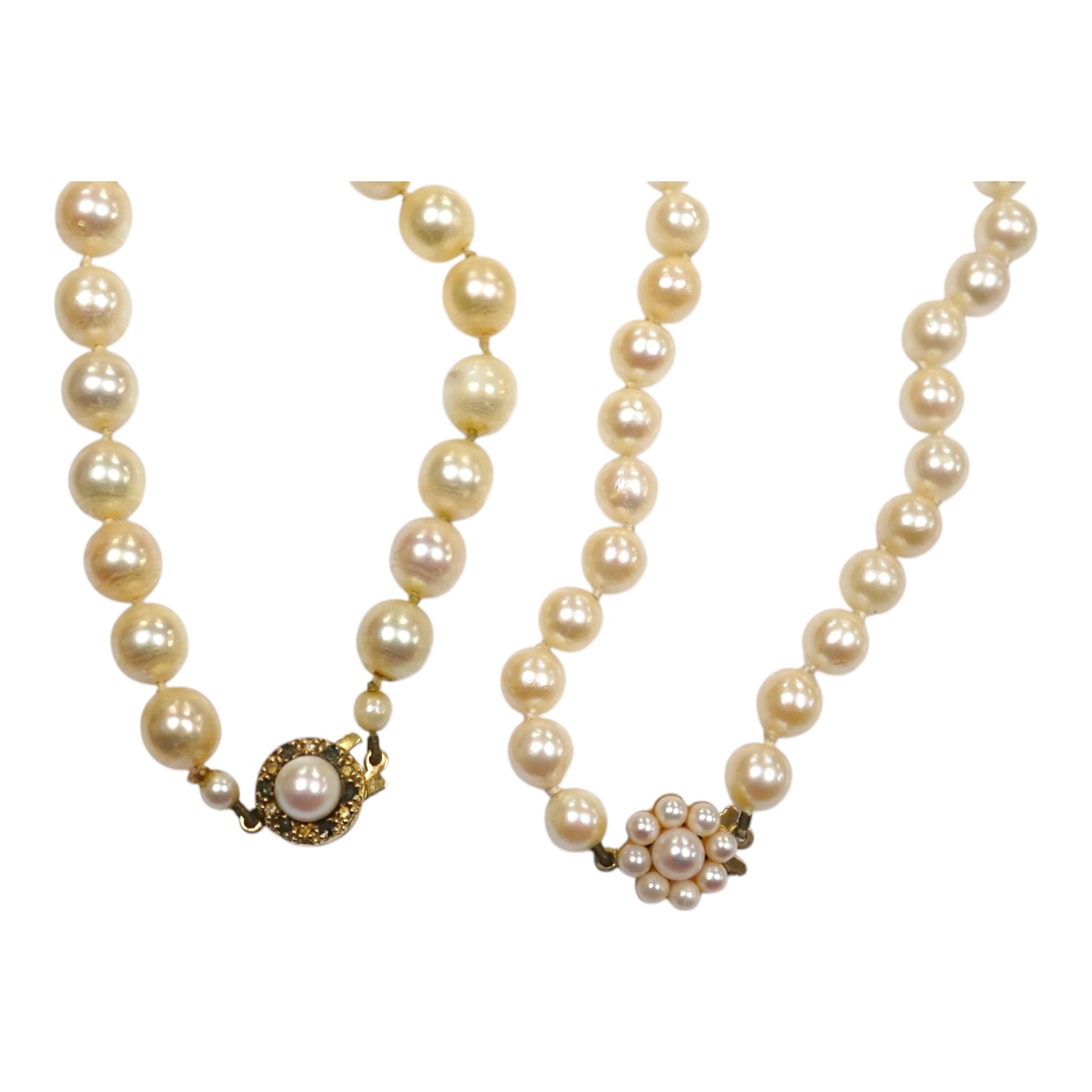 Two modern single strand cultured pearl necklaces, one with cultured pearl and gem set 18ct gold clasp, 48cm, the other with cultured pearl cluster set 9ct gold clasp, 54cm. Condition - fair to good.